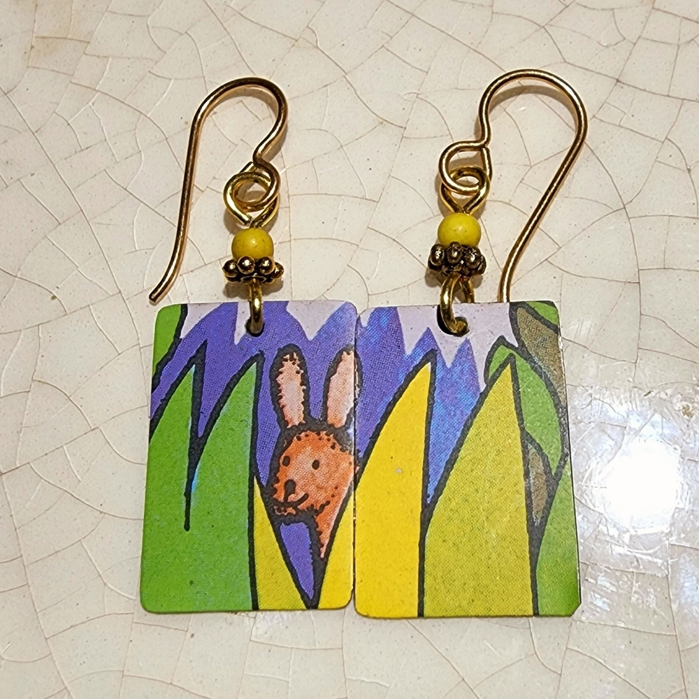 Handpainted bunny in the grass scene on metal fish hook a earrings.